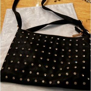 Cato cross body bag with rhinestones in the front and sold black on back of bag.